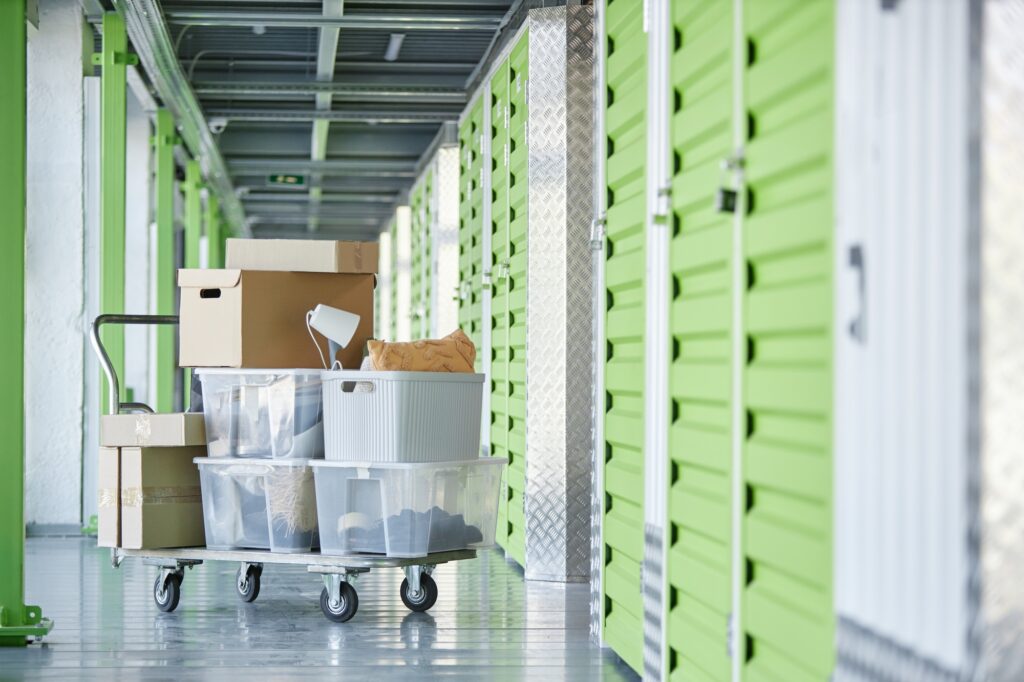 Boxes with Personal Possessions Loaded on Transportation Trolley in Self Storage Warehouse